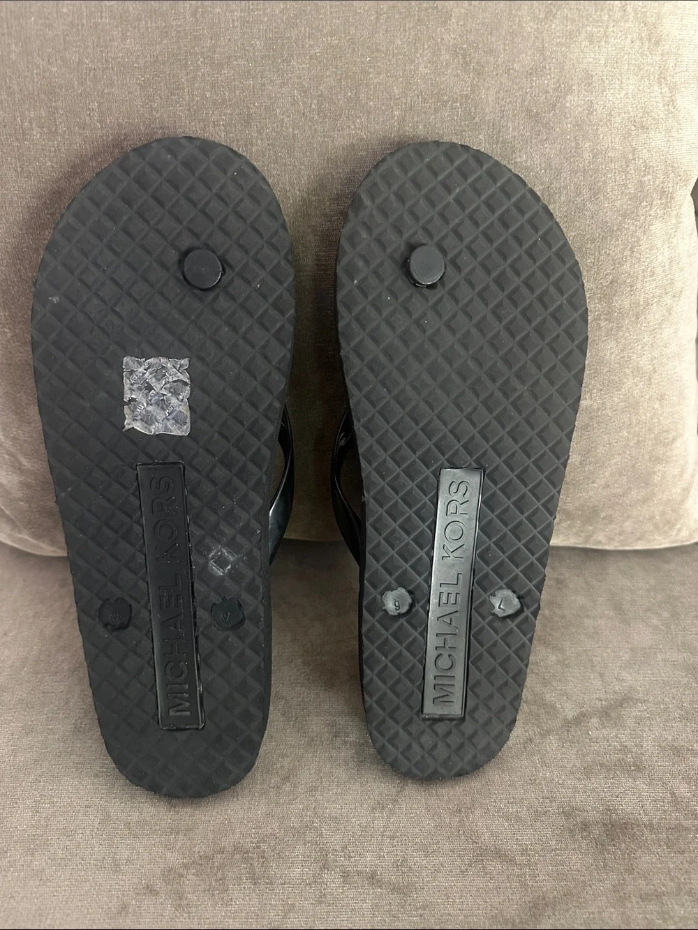 Michael Kors flip flops.  New W/O tags. Size 9